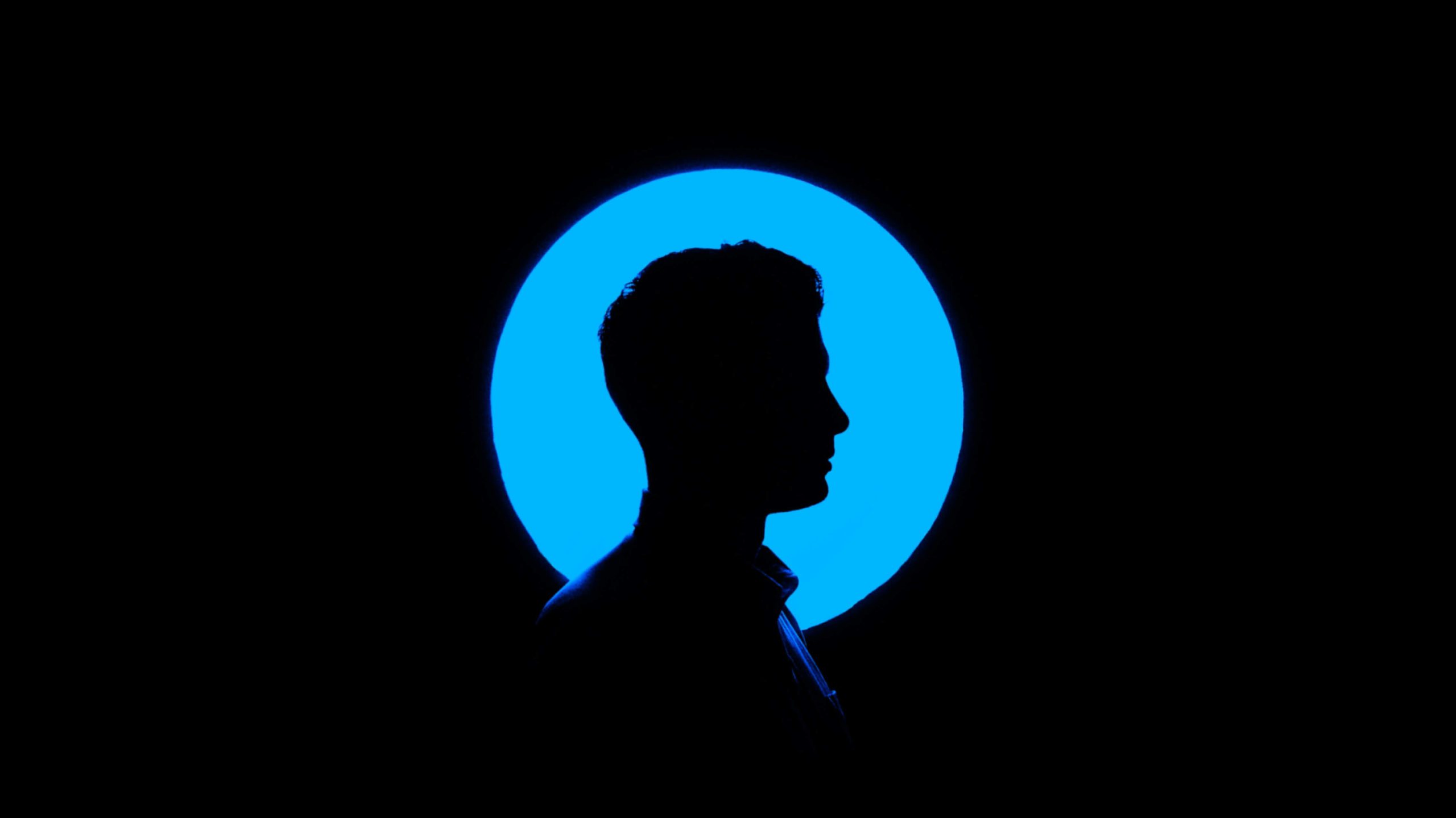 A silhouette of a man on a blue background